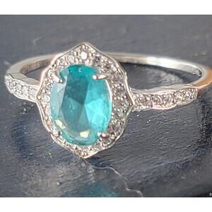 Stunning Rhodium-Plated Size 9 Ring with Aqua Blue Gemstone and Halo Accents